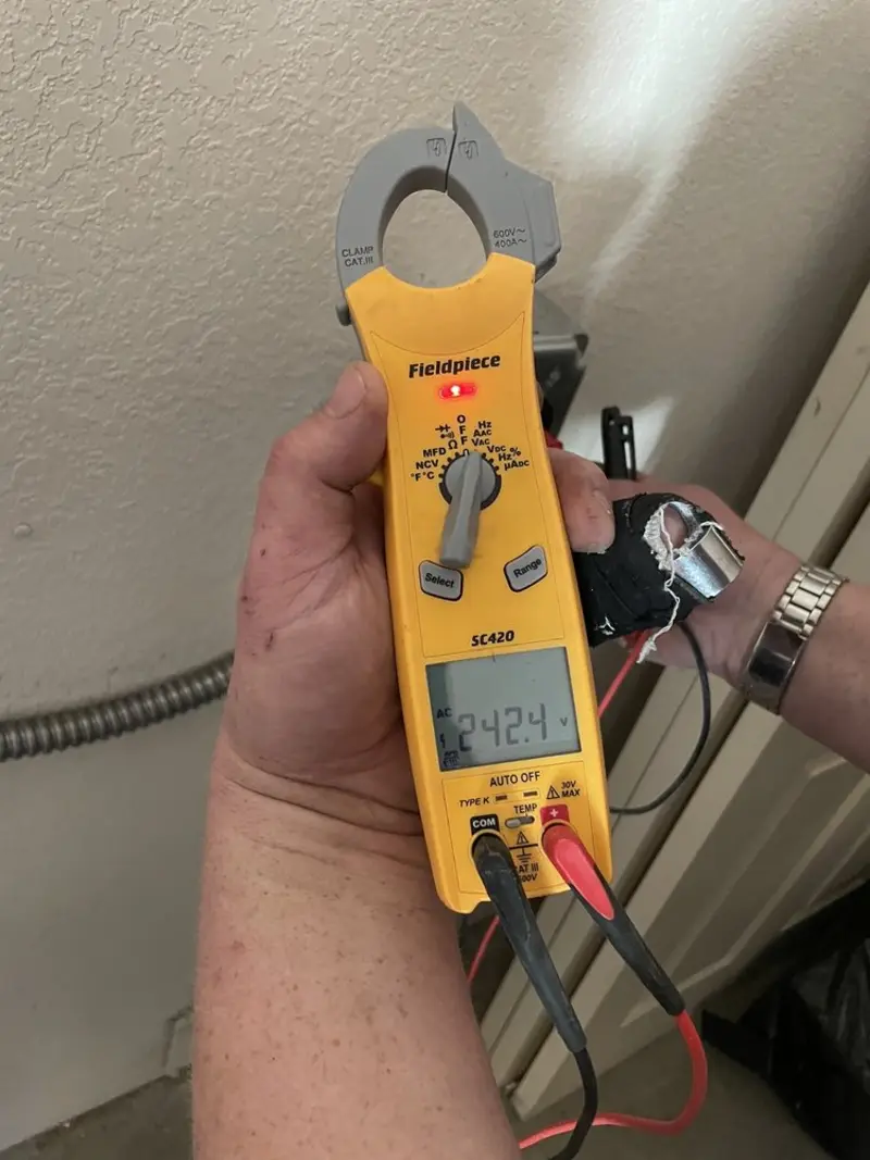 Voltage testing with clamp meter during Generator Installation in Wausau